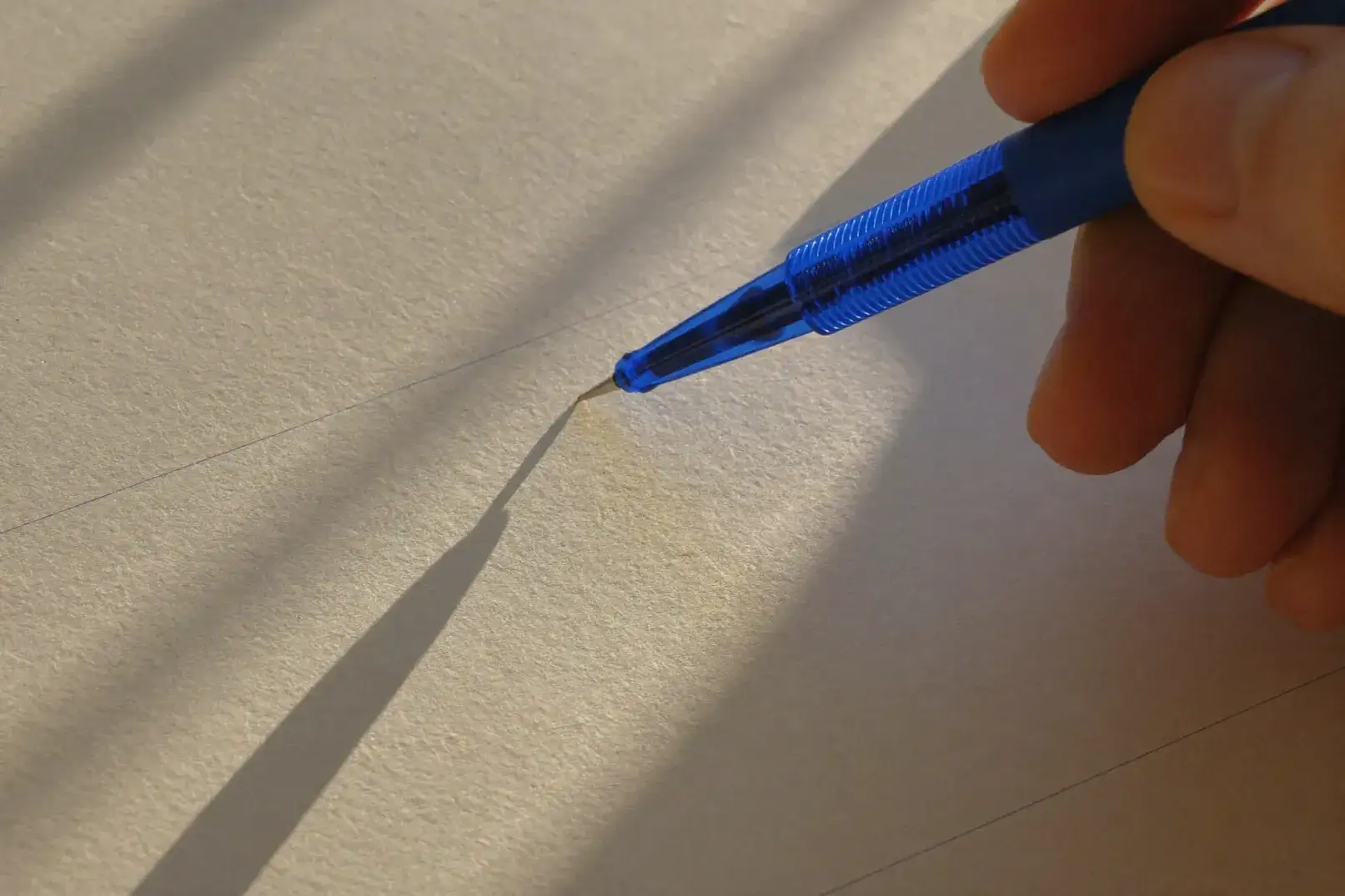 A pen resting on a printed sheet of paper